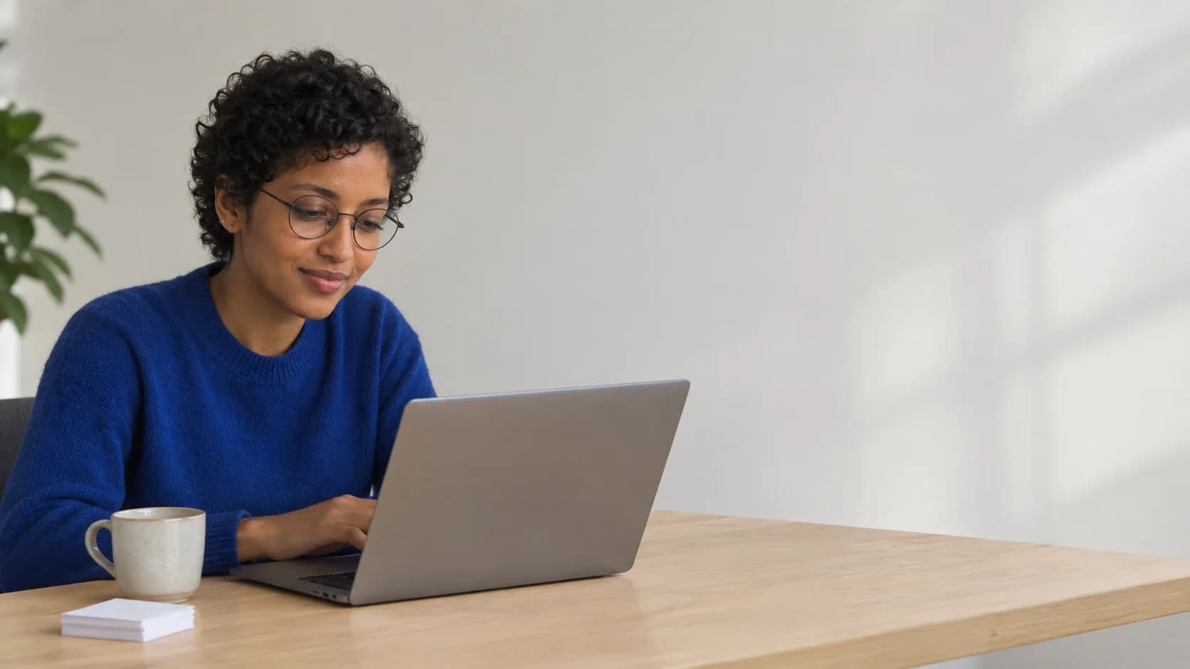 A learner working through a study session at her desk